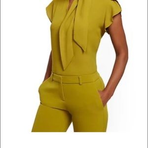 New York & Company Tulip sleeve bow blouse size Med.